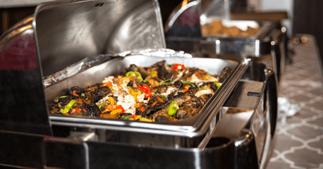 Buffet-Style Catering – Hot & Fresh Jamaican Cuisine for Your Event A variety of Jamaican dishes in chafing warmers, ready for buffet-style catering