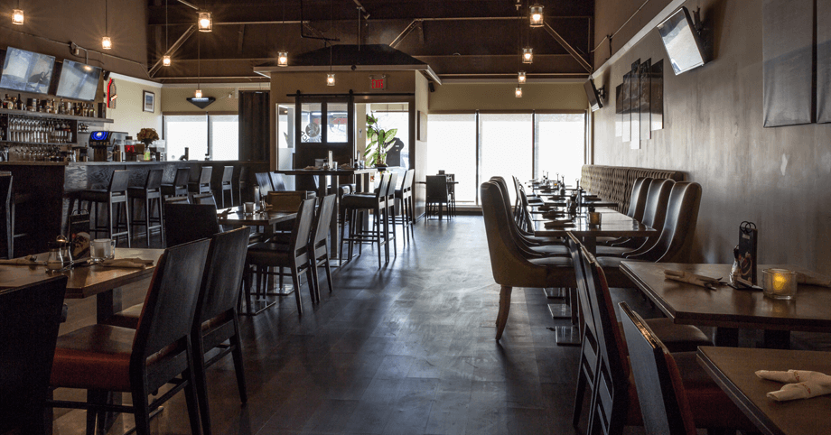 Experience the Cozy & Elegant Atmosphere at Xaymaca Restaurant Xaymaca Restaurant interior with dimmed lights, offering a warm and inviting ambiance