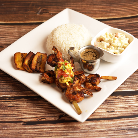 Click to view full image of jerked shrimps with rice and sides Jerked shrimps with white rice, plantain, and macaroni salad – thumbnail view